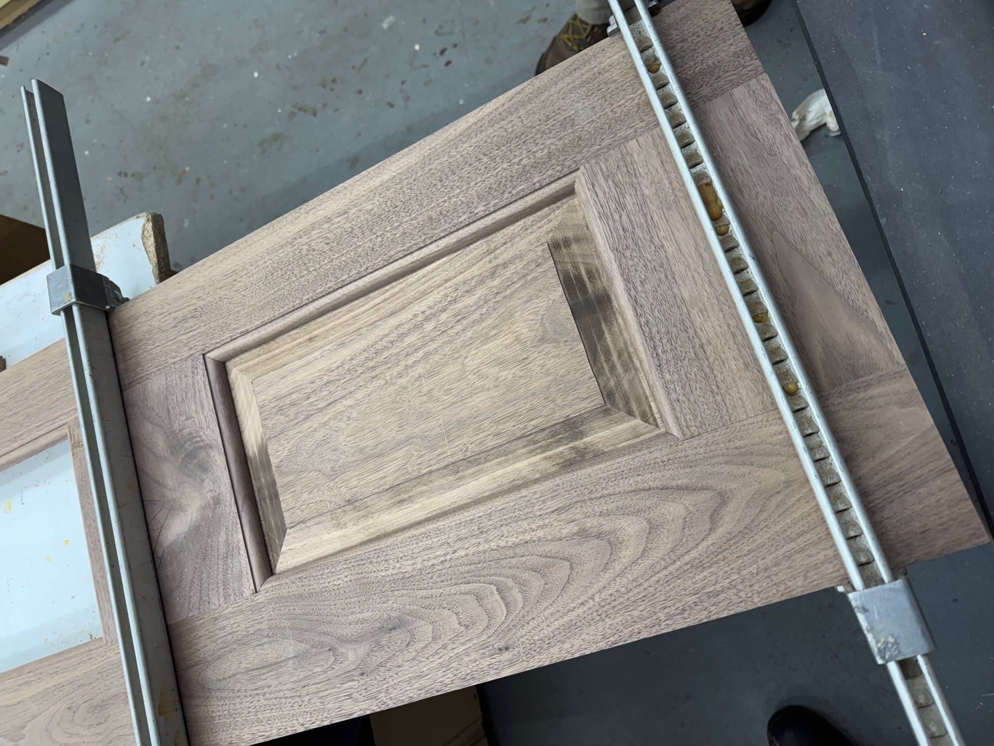 Walnut raised-panel door being assembled in the Maidstone workshop
