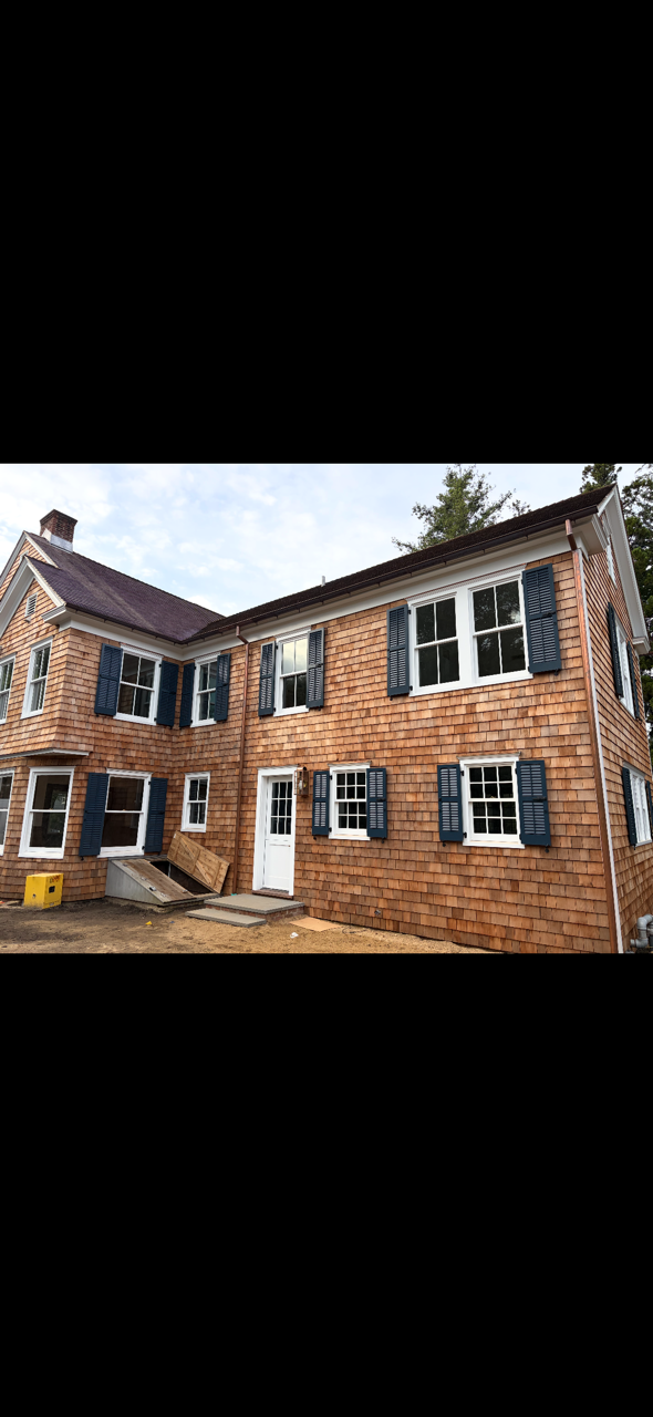 Rear elevation of the Main Street residence showing the coordinated exterior shutter package
